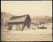[Family Seated by Thatched Hut, South America]