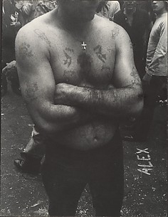 [Shirtless, Tattooed Man with Arms Folded, on Street, New York]