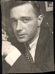 [Walker Evans in Front of Resettlement Administration Poster]