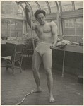 [Male Model Posed Pulling a Rope in Anna Huntington's Rooftop Studio]