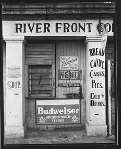 [Painted and Posted Advertisements on Façade of 