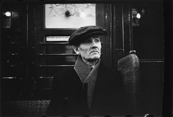 [Subway Passenger, New York City: Man in Cap and Scarf]