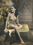 [Girl, Nude from Waist Up, Seated in Front of Painted Backdrop]