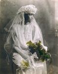 [Seated Bride Holding Spray of Ferns]