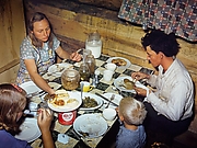 The Fae and Doris Caudill Family Eating Dinner in Their Dugout
