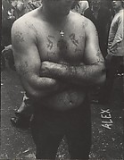 [Shirtless, Tattooed Man with Arms Folded, on Street, New York]
