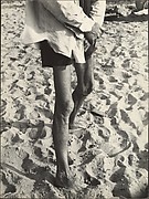 [Beach Scene: Man with Light Shirt and Dark Shorts, Coney Island, New York]