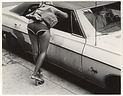 [Street Scene: Woman in Shorts Leaning into Window of Parked Car, New York City]