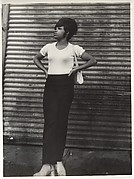 [Street Scene: Woman in White Tee Shirt and Black Pants, New York City]