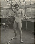 [Male Model Posed Pulling a Rope in Anna Huntington's Rooftop Studio]