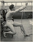 [Male Model Posed Pulling a Rope in Anna Huntington's Rooftop Studio]