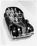 [Packard Automobile with Six Passengers Seen through Graphic Cut-away of the Roof]