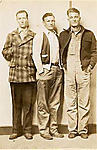 [Two Young Men Standing with Older Man]