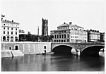 [View of the Pont au Change and the buildings on Place du Chàtelet, with the Tour Saint-Jacques in the background]