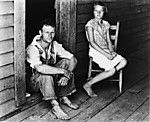 [Floyd and Lucille Burroughs on Porch, Hale County, Alabama]