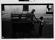 [Vendor with Child Customer, Greenwich Village, New York City]