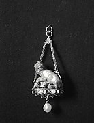 Pendant with a lion attacking a camel