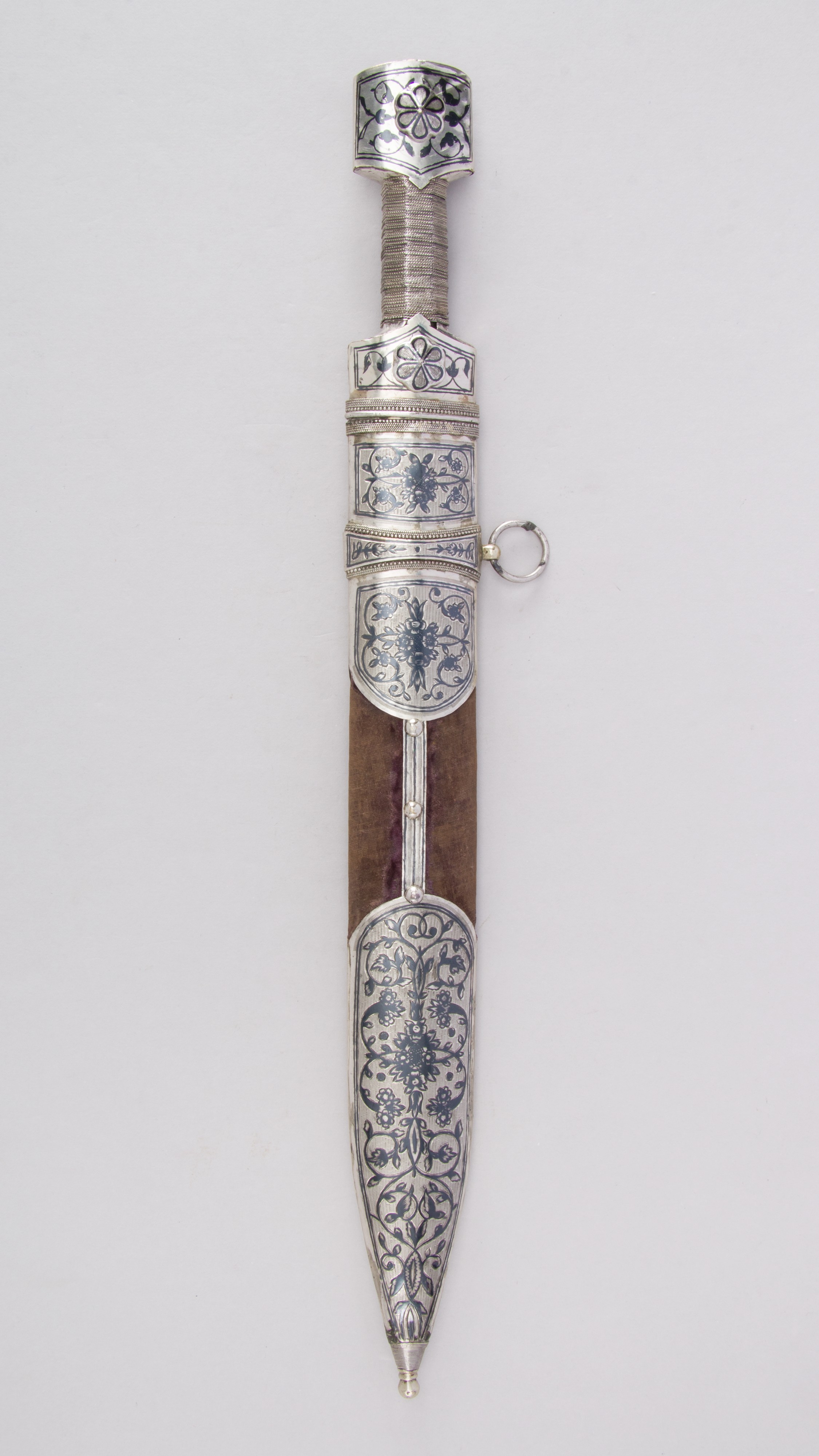 Caucasian qama or kindjal dagger, the 15cm pointed double edged blade with  centre fuller and two-piece horn grip; in nickel plated scabbard with  panels of figures and script L28.5cm overall; and east 