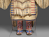 Woman’s Dress and Accessories, Jodi Archambault (American, Hunkpapa Lakota/Teton Sioux, born North Dakota, 1969), Tanned and commercial leather, glass and metal beads, cotton, silk, dentalium shell, metal cones, horsehair, plastic, brass bells, porcupine quills, coins, Hunkpapa Lakota (Teton Sioux)