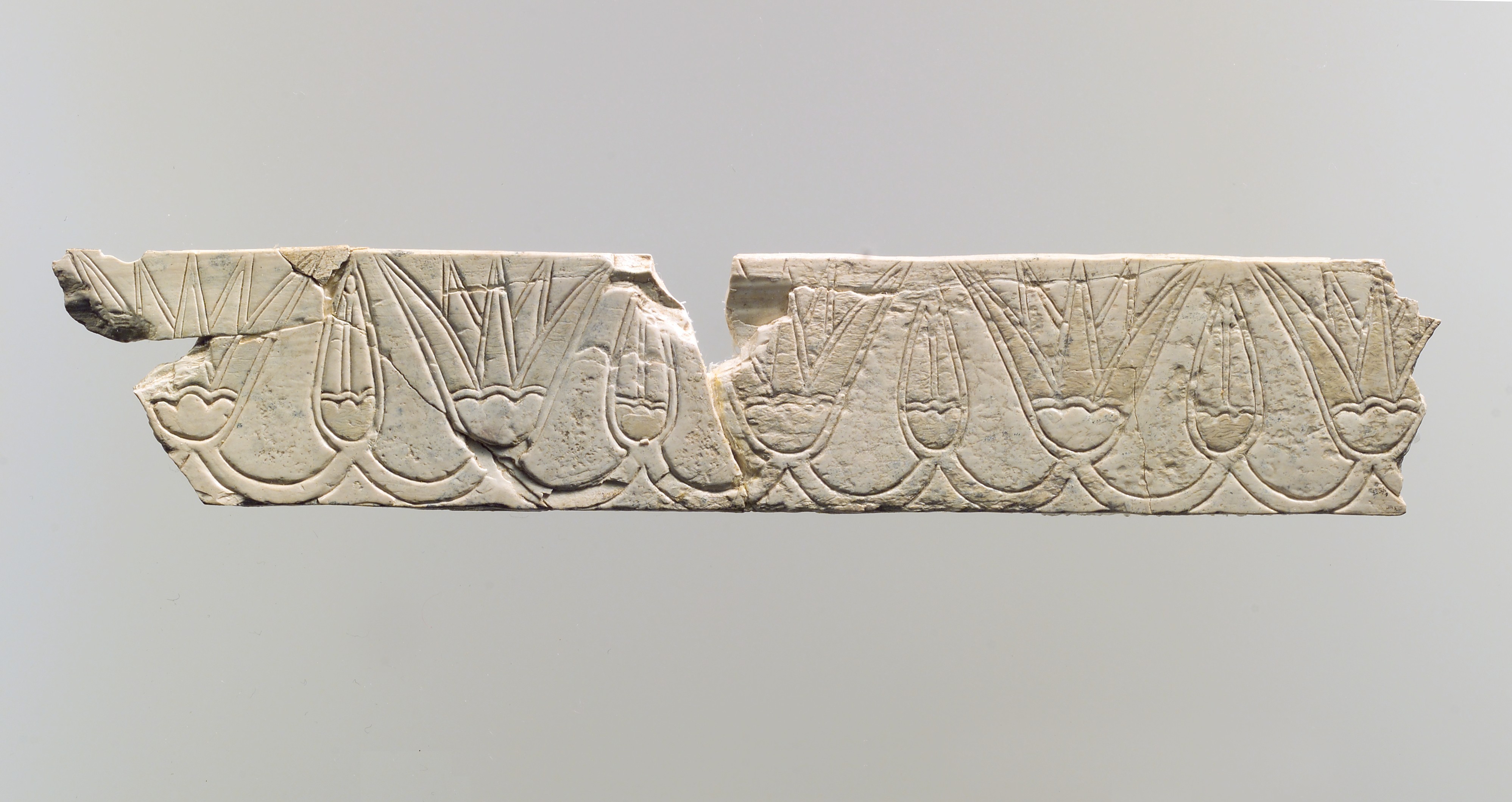 Incised furniture plaque with The buds Metropolitan blossoms | and Museum of | Art frieze | Assyrian of Neo-Assyrian lotus a