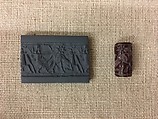 Cylinder seal with hunting scene, Mottled red Jasper (Quartz), Assyrian