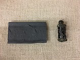 Cylinder seal (with caps preserved) with animals and divine symbols, Black Steatite, copper/bronze caps, Assyrian