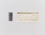 Cylinder seal and modern impression: deity, goat, and worshiper; terminal; sphinxes, guilloche, bull and leaper (?), Hematite