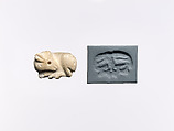 Seal amulet in the form of a reclining cow, Stone