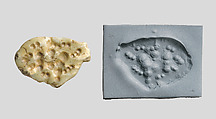 Seal amulet in the form of a recumbent fox, Calcite, green (?)