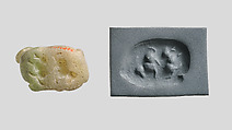 Seal amulet in the form of a recumbent bovid, Onyx marble, green-gray