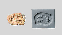 Seal amulet in the form of a recumbent fox, Marble, cream with red veins (?)