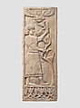 Panel with a youth grasping a tree; winged sun disc above, Ivory, Assyrian