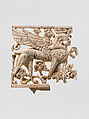 Openwork plaque with a sphinx striding through a floral landscape, Ivory, Assyrian