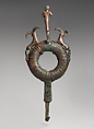Top of standard with male figure and flanking ibexes attacked by dogs, Bronze, Elamite
