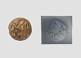 Double convex discoid (bulla) seal engraved on two faces, Yellow-tan limestone, Hittite
