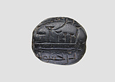 Low hemispheroid seal with later inscription, Steatite, black