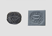 Low hemispheroid seal with later inscription, Steatite, black