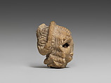 Female head with elaborate hairstyle, Gypsum alabaster