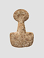 Spade-shaped schematic female (?) figure, Limestone
