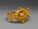 Hinged bracelet with Assyrian human-headed winged bull medallion, Gold , British
