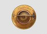 Brooch with Assyrian human-headed winged bull, Gold, enamel, glass, British