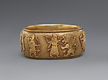 Bracelet with Assyrian-inspired design, Gold, British