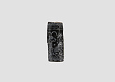 Cylinder seal (with pin preserved) with animal-monster contest scene, Black Steatite, with copper/bronze pin, Assyrian