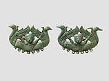 Harness or bridle fitting (?) in the form of a mistress of animals and waterbirds, Bronze