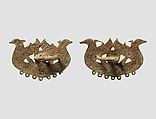 Harness or bridle fitting (?) in the form of a mistress of animals and waterbirds, Bronze