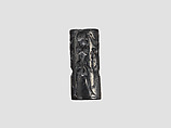 Cylinder seal and modern impression: human figure flanked by sphinxes, birds, Hematite, Cypriot