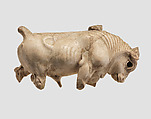 Furniture or cosmetic box plaque carved in the round with striding bull, Ivory, gold foil, Assyrian