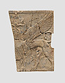 Furniture plaque carved in relief with a winged, falcon-headed sphinx, Ivory, Assyrian