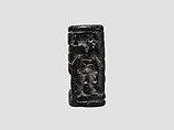 Cylinder seal and modern impression: man grasping an antelope, bull's head over ingot, Black-grey steatite, Cypriot