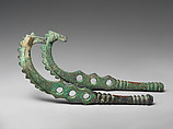 Horse bit cheekpieces in form of a horse with spiked mane, Bronze